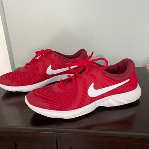 Nike size 7 youth red athletic shoes.